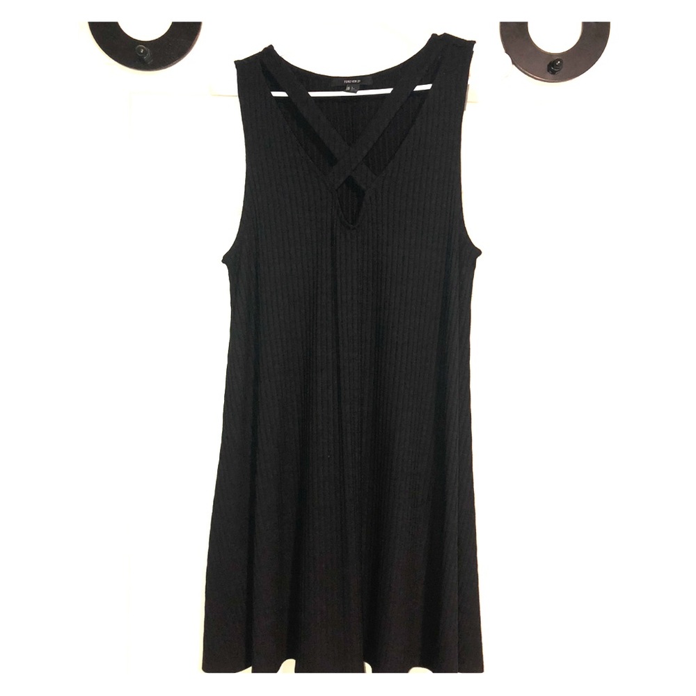 Black dress. Cross cross chest.